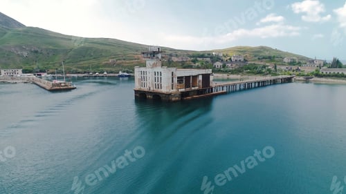 Preview: Abandoned coastal village. Shot. Top view of abandoned fishing village on coast of blue sea