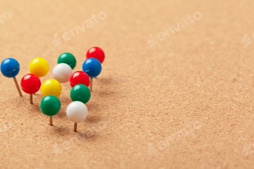 Preview: Group of thumbtacks pinned on corkboard close up. School or business concept