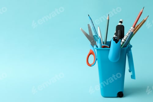 Preview: Holder in the form of trash can with stationery on blue background
