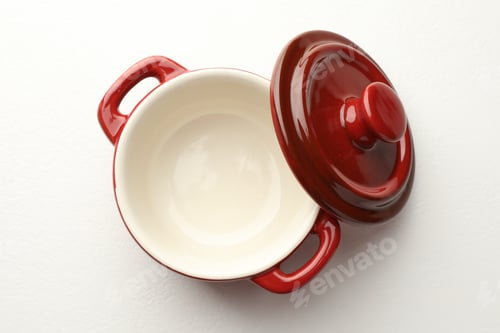 Preview: Ceramic casserole and lid on white table, top view