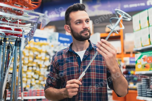 Preview: hardware store buyer chooses a mixer for building mixtures.