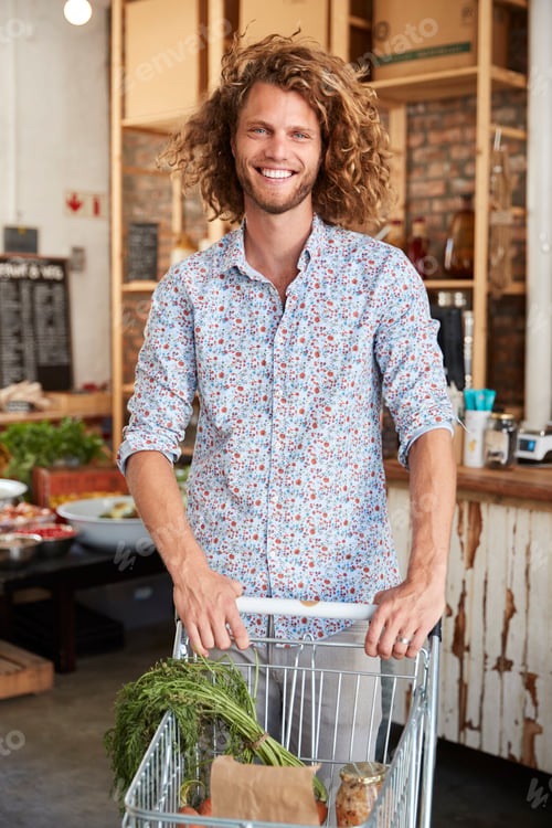 Preview: Portrait Of Man With Trolley Buying Fresh Fruit And Vegetables In Plastic Free Grocery Store