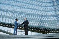 Preview: Shaking Hands in Corporate Glass Building