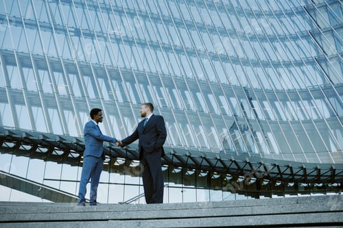 Preview: Shaking Hands in Corporate Glass Building
