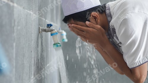 Preview: A portrait of an asian muslim ablution at mosque before pray
