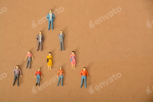 Preview: people forming a team in a pyramid shape, the idea of a hierarchical structure group or organization