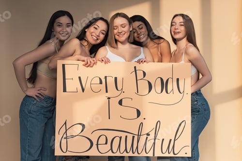 Preview: five cheerful multicultural girls holding placard with"every body is perfect" inscription