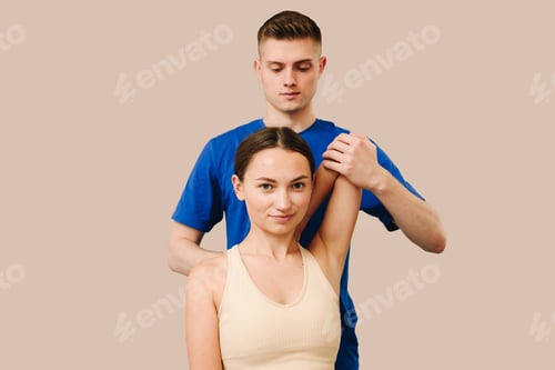 Preview: Female patient receiving osteopath treatment to restore neck flexibility