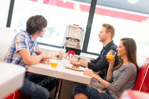 Preview: Friends eating in diner