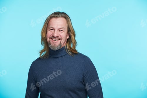 Preview: Handsome man smiling at camera