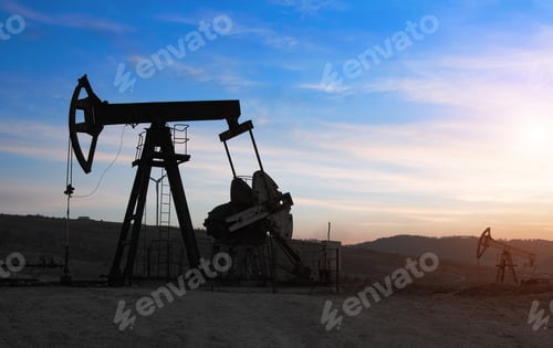 Oil Pumps at Sunset in Rural Area