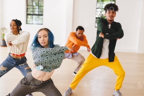 Preview: Image of diverse female and male hip hop dancers during training in dance club