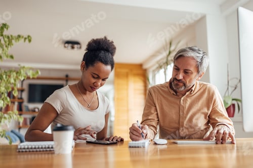 Preview: Colleagues working from home at a table