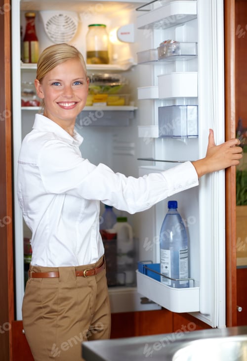 Preview: What can I. A gorgeous young woman opening her fridge and smiling at you.