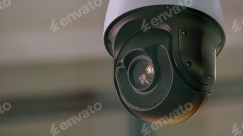 Preview: Close-up of surveillance video camera rotating around.