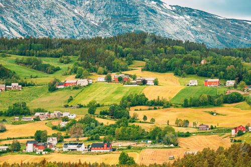 Preview: Voss, Norway. Summer Scenic Landscape With Fields And Red Farm Buildings. Traditional Norwegian