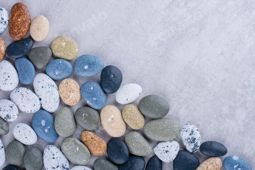 Preview: Multicolor decorative stones isolated on concrete background