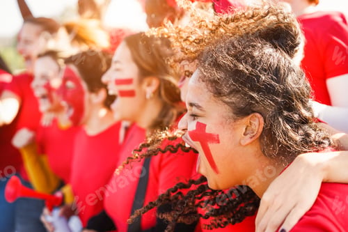 Preview: Multiracial red sport fans screaming while supporting their team