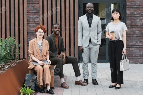 Preview: Horizontal long shot of successful multi-ethnic men and women wearing fashionable elegant clothes