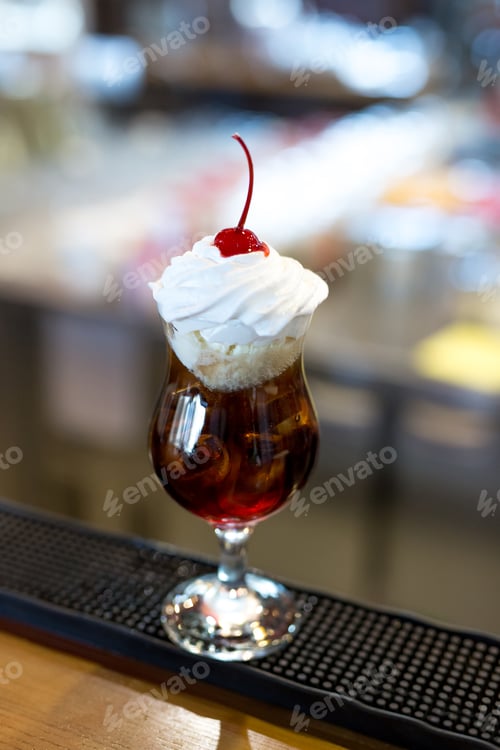 Preview: Cocktail with Coca-Cola, ice, ice cream and whipped cream close-up