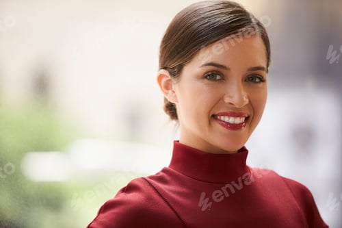 Preview: Head and shoulders portrait of young white businesswoman