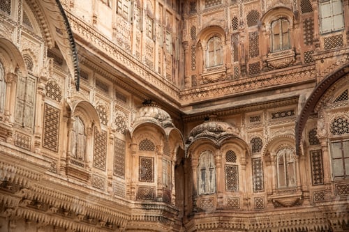 Preview: Intricate sandstone carvings adorning facade of Udaipur City Palace in India