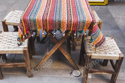 Preview: Traditional oriental decoration cafe, colorful blanket with fringe and ornament, cozy small chairs