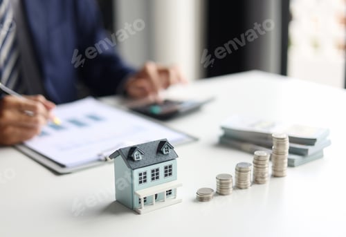 Preview: Real estate agent/ investor calculating, planning, analyzing financial data for property investment.