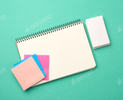 Preview: Open notebook with blank white sheets, color stickers and rectangular business cards