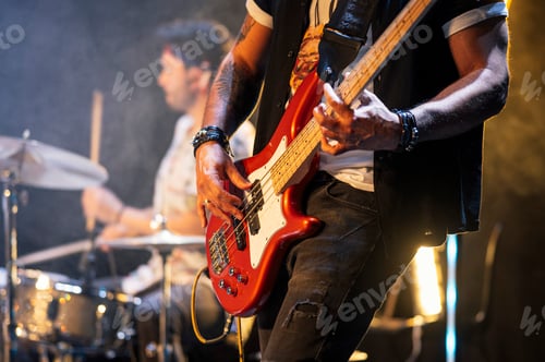 Preview: Rock and roll group performing live.