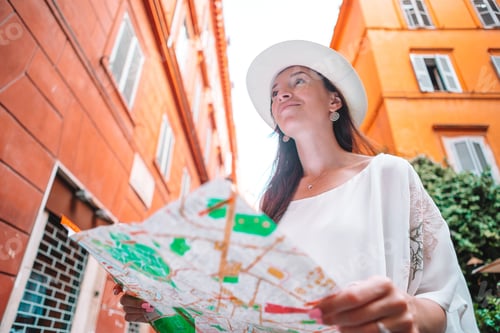 Preview: Travel tourist woman with map in Prague outdoors during holidays in Europe