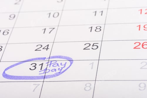 Preview: selective focus of calendar with marked number 31 and 'pay day' lettering