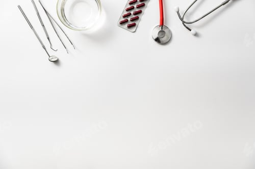 Preview: Flat lay of white medical background, analgesic treatment of a dentist.
