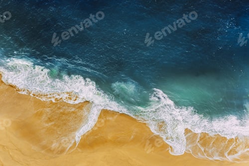 Preview: Sea coast, view from the height. Yellow sandy beach with blue sea