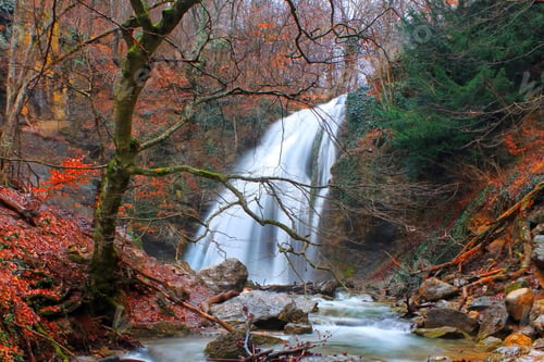 Preview: Beautiful autumn landscape with a waterfall in the autumn forest