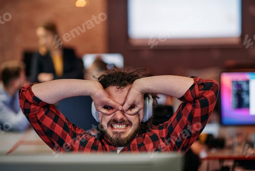 Preview: Joyful Collaboration: A Man Embracing Remote Work with Enthusiastic Gestures in a Coworking Space.