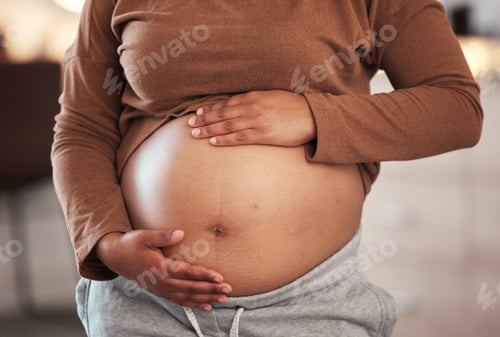 Preview: Hands, stomach and pregnant black woman in home for maternity leave, health and wellness. Pregnancy