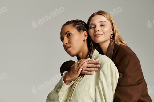 Preview: Beautiful young couple embraces warmly, showcasing autumn styles amid a cozy indoor setting