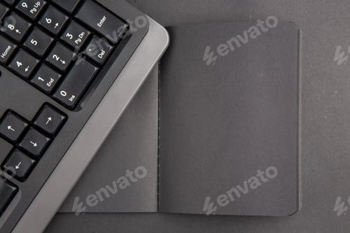 Preview: top view black notebook keyboard on dark background