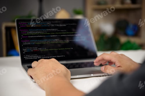 Preview: Developer working on intrusion detection system code in JavaScript