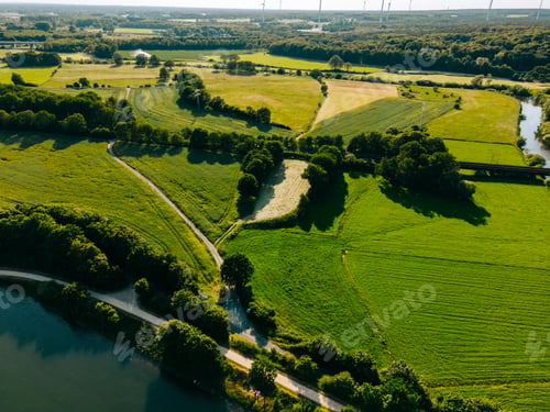 Preview: Summer aerial drone view landscape navigable river with bridges, agricultural fields and forests