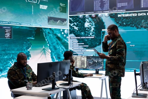 Preview: Military team in a command center uses advanced technology on big screen