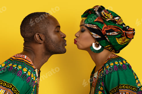 Preview: Closeup of loving black couple kissing on yellow