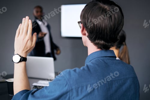 Preview: Shot of a unrecognizable businessman lifting his hand in a office meeting