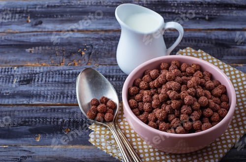 Preview: Chocolate cereal balls in bowl and milk