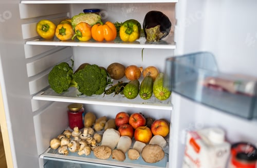 Preview: Open fridge full of vegetables and fruits.