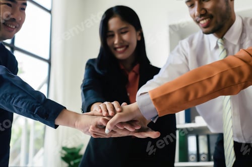Preview: People with fist put together during support group session, Business team putting hands together