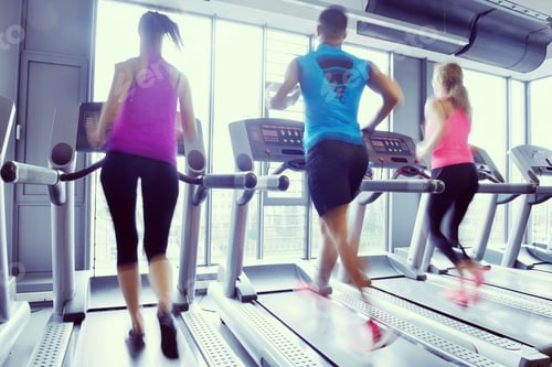 Preview: Group of people running on treadmills