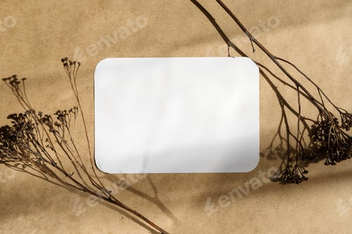 Preview: Blank paper sheet on a kraft paper with dry grass