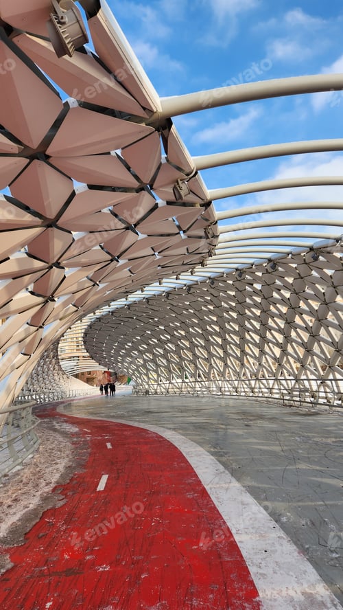 Preview: Modern architectural urbanistic Atyrau fish bridge across Ishim river. Pedestrian bridge with